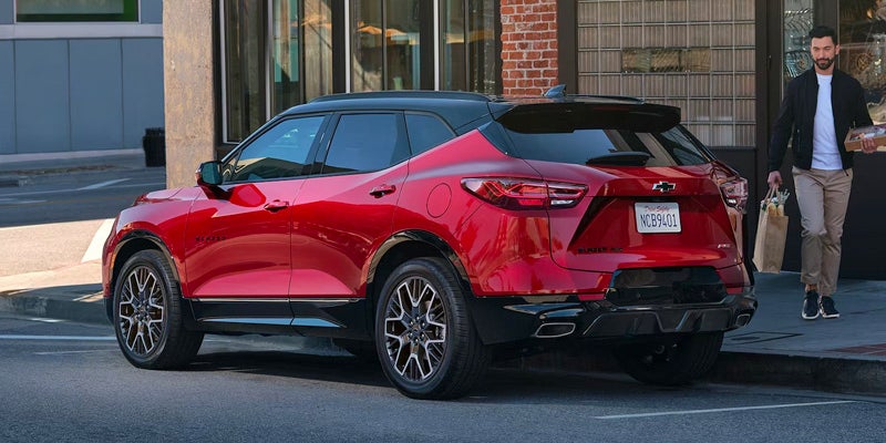 A 2024 Chevrolet Blazer parked on a city street, showcasing its sleek design and modern features.